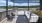 a deck with chairs and a table