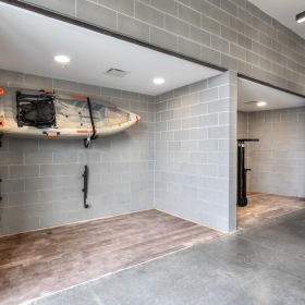 Find your perfect fit at The Yards Apartments a large room with a large stone wall and a large white sign