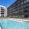 a swimming pool in a courtyard between buildings