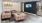 a living room with a tv and couches