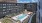 a pool in a courtyard between buildings