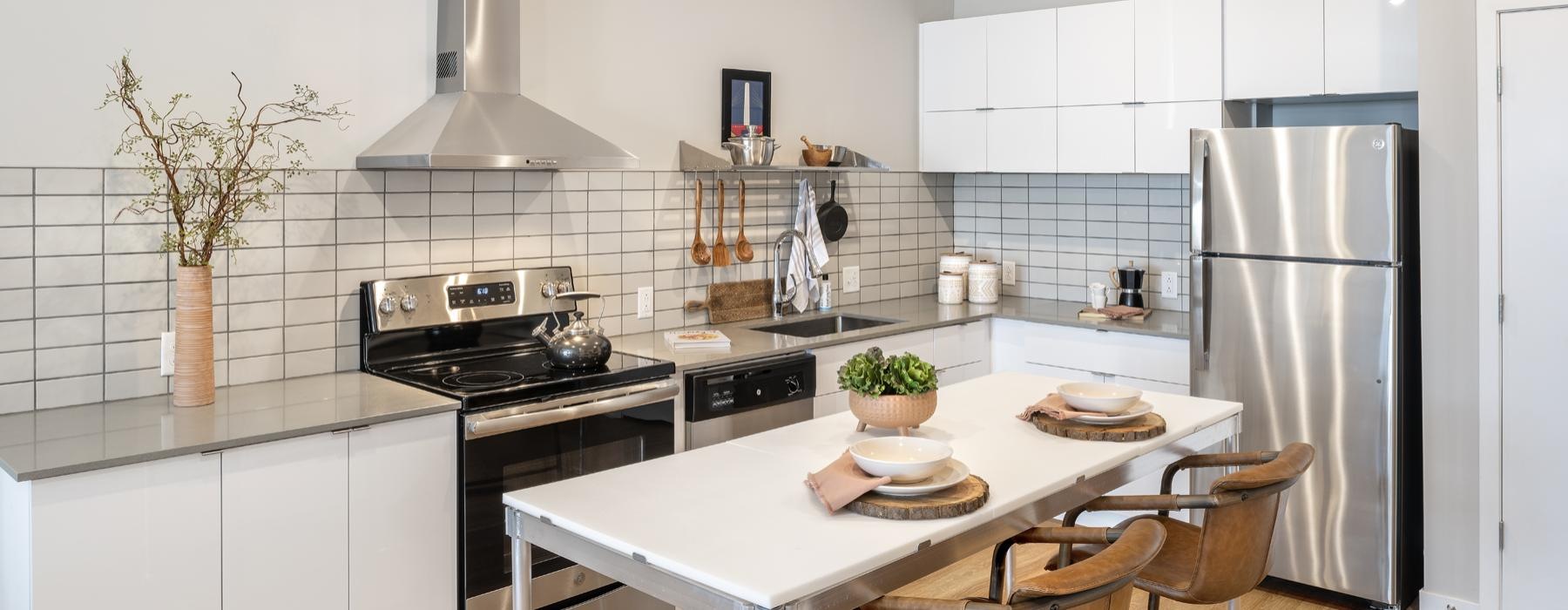 a kitchen with white cabinets