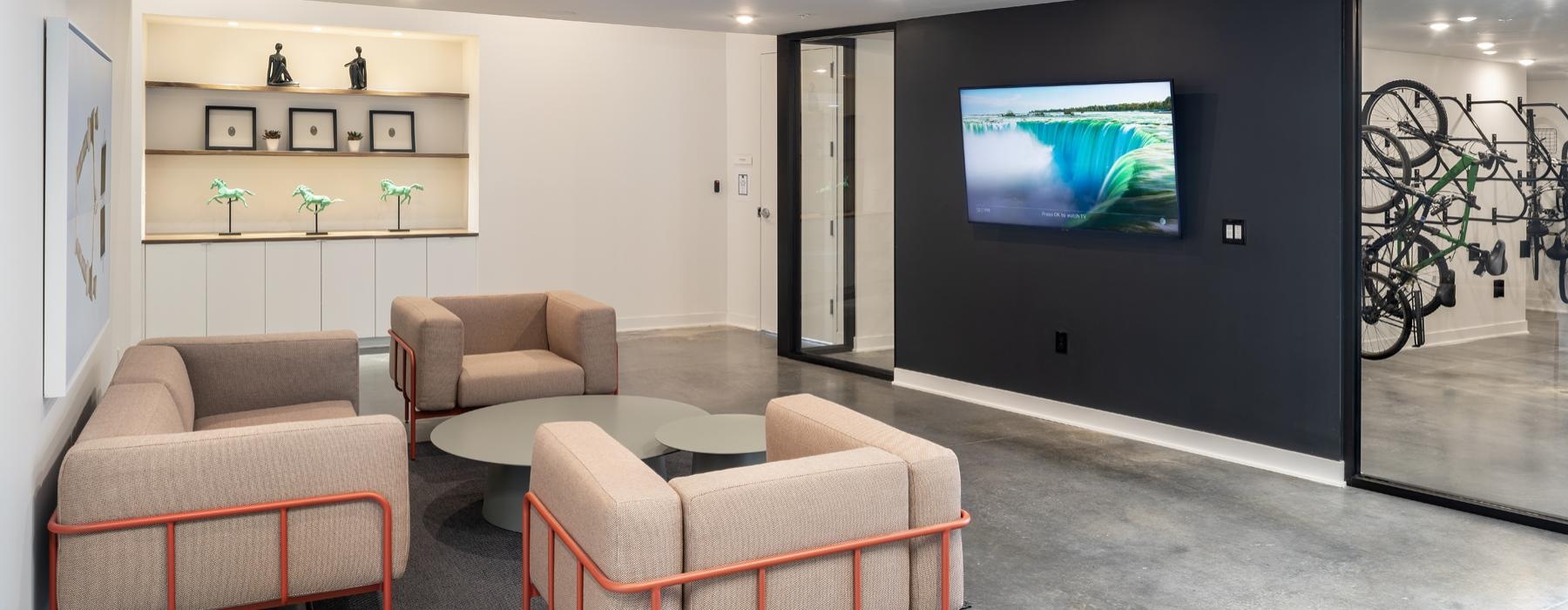a living room with a tv and couches