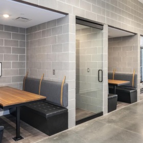 Settle into comfort at The Yards Apartments a room with a table chairs and a couch