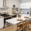 a kitchen with white cabinets