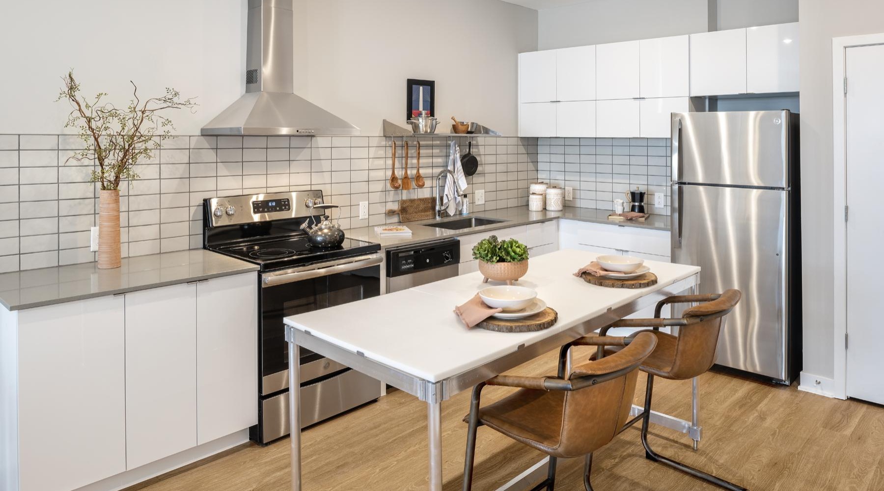 a kitchen with white cabinets